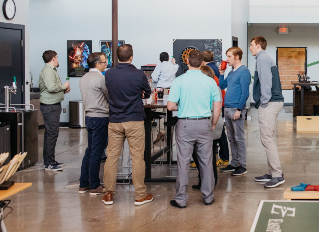 Volano Software team members standing around chatting